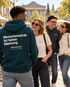 Person im petrolfarbenen Wearmorrow® Hoodie mit der Rückenbotschaft Menschenwürde ist keine Meinung in einer Gruppe
