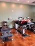 Patient lying on a spinal adjustment table in a room.
