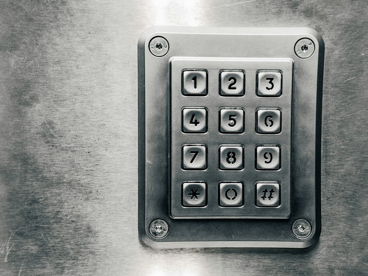 A homeowner unlocking a front door with a phone app