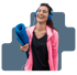 Smiling woman in pink jacket holds yoga mat, highlighting detox therapy.