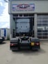 Rückansicht einer LKW-Zugmaschine vor der Werkstatt BF-Fahrzeugtechnik mit Liqui Moly Werbeschild.