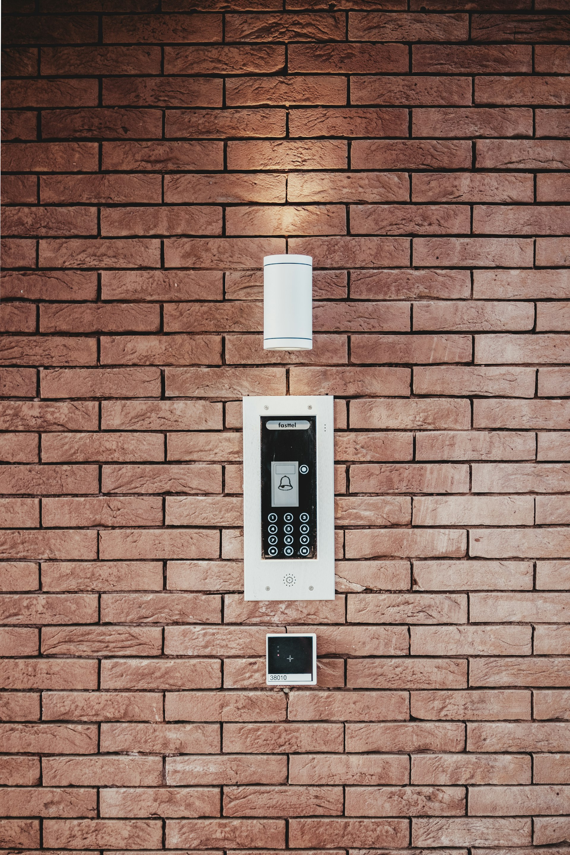 An alarm keypad beside the entry door of a monitored San Mateo home