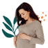 Smiling pregnant woman holding belly