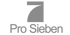 Graues ProSieben Logo mit der stilisierten Zahl Sieben auf schwarzem Hintergrund.