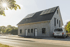 Einfamilienhaus mit Solaranlage auf dem Dach und einem weißen Van davor.