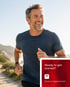 A man in a blue shirt jogs, thanks to bone on bone joint pain treatment.