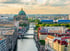 Berliner Dom und Spree bei Sonnenuntergang mit Blick über die Dächer der Berliner Innenstadt.