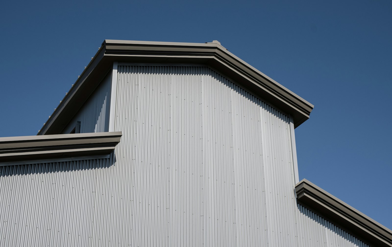 Standing seam metal roof on a gabled building with concealed fasteners