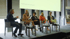 Fünf Personen auf einer Bühne bei einer Podiumsdiskussion mit der Aufschrift "Norddeutscher Innovationstag 2023" an der Wand.