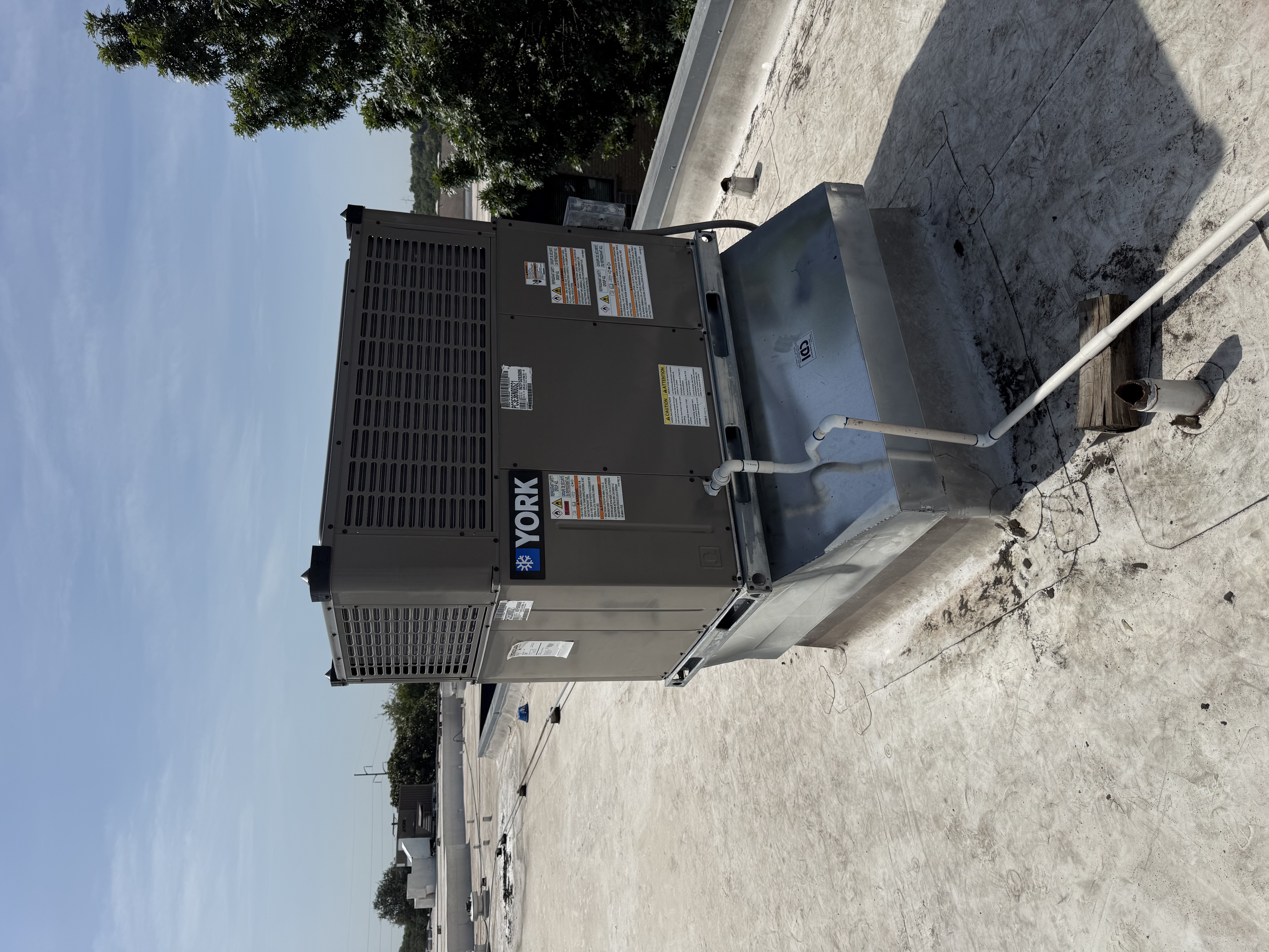 York packaged rooftop HVAC unit installed on a commercial roof curb