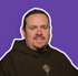 A smiling man with a beard and mustache wears a brown Franciscan habit with a cross emblem.