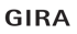 Gira Logo in grauer serifenloser Schrift auf schwarzem Hintergrund.