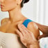 Physical therapist helping patient with shoulder pain