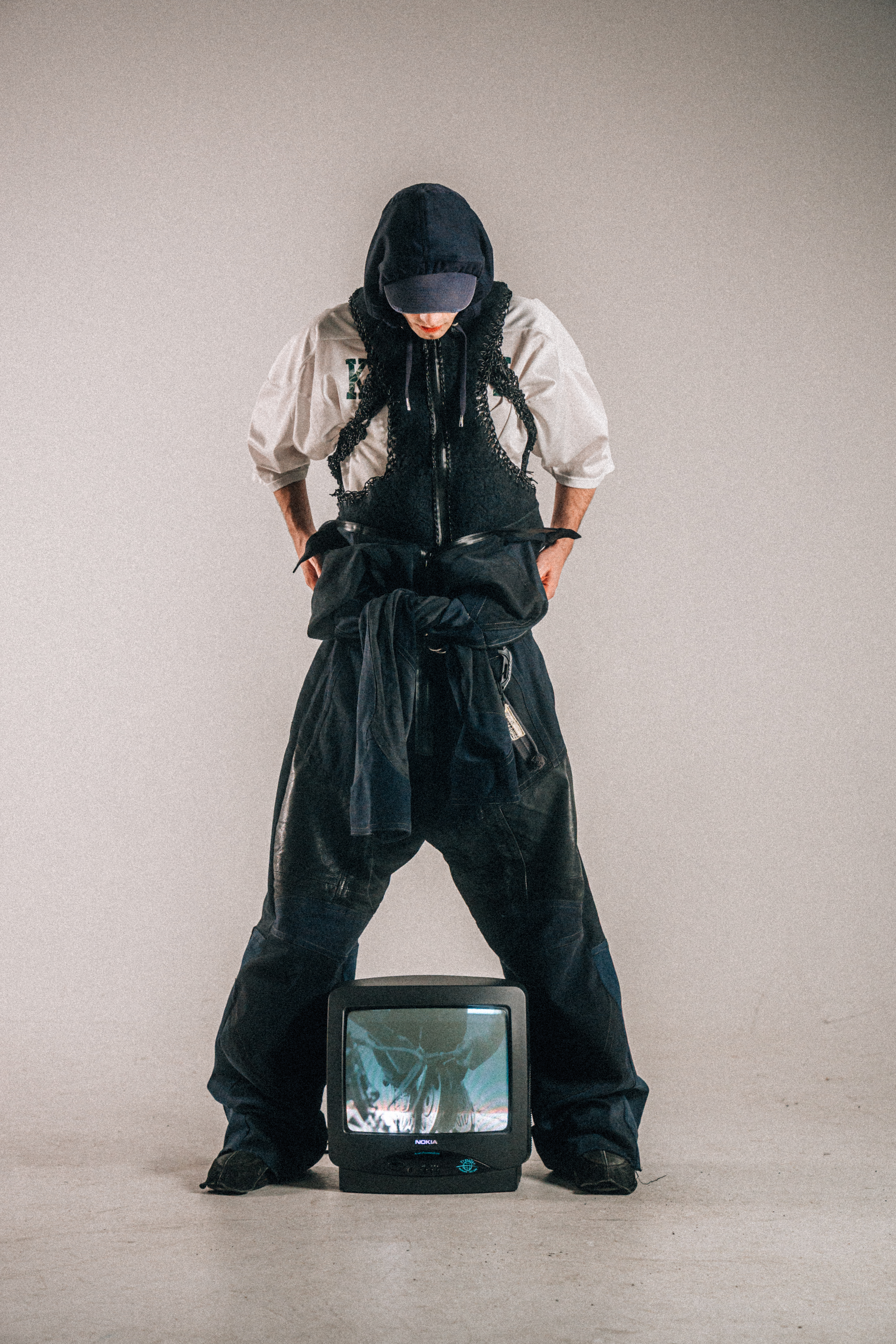 Denim and leather racing suit and deconstructed protective vests