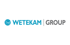 WETEKAM GROUP Logo mit blauem Punkt, blauem "WETEKAM" und grauem "GROUP" auf grünem Hintergrund.