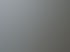 Glasüberdachung mit sechs mattierten Glasplatten und grauem Rahmen, an weißer Hauswand über Kiesfläche.