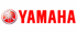 Rotes Yamaha Logo mit drei gekreuzten Stimmgabeln in einem Kreis auf schwarzem Hintergrund.