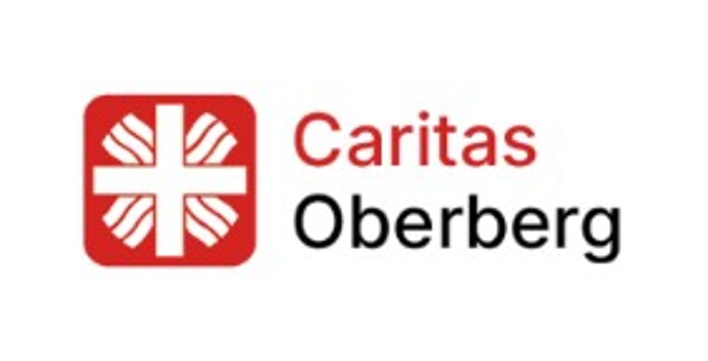 Logo der Caritas Oberberg mit dem roten Flammenkreuz-Symbol und dem Schriftzug Caritas Oberberg.