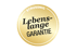 Goldenes Siegel von Strussnig mit der Aufschrift lebenslange Garantie auf schwarzem Hintergrund.