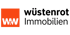 Wüstenrot Immobilien Logo: Orangefarbenes Quadrat mit weißem "W&W" und schwarzem Text "wüstenrot Immobilien".