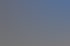 Modernes graues Gebäude mit roter Aufschrift "Emmerich 24", "Jetzt registrieren", und "emmerich-24.com".