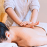 Therapist performing a therapeutic back massage