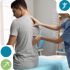 Physical therapist assessing man’s back for spinal decompression therapy