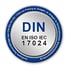 Silberner Kreis mit DIN EN ISO IEC 17024 Logo und Text "Zertifizierte Sachverständige nach DIN EN ISO IEC 17024".