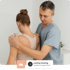 A Doctor adjusts a woman's upper back and shoulder. Lasting Healing.