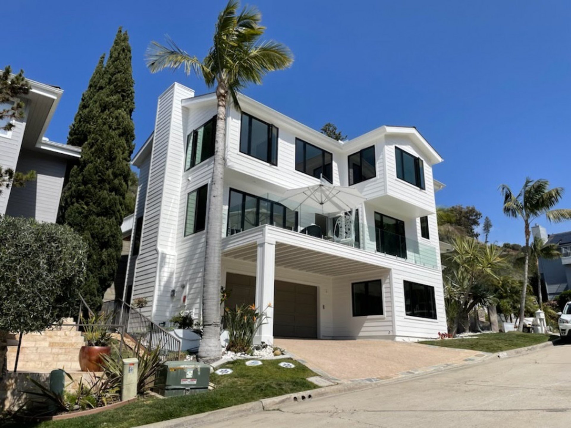 Windows, Siding, and Texture Coating Update an Oceanfront Home in La Jolla
