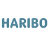 Der Text "HARIBO" in blauen, glänzenden, aufgeblasenen Buchstaben auf dunkelgrünem Hintergrund.