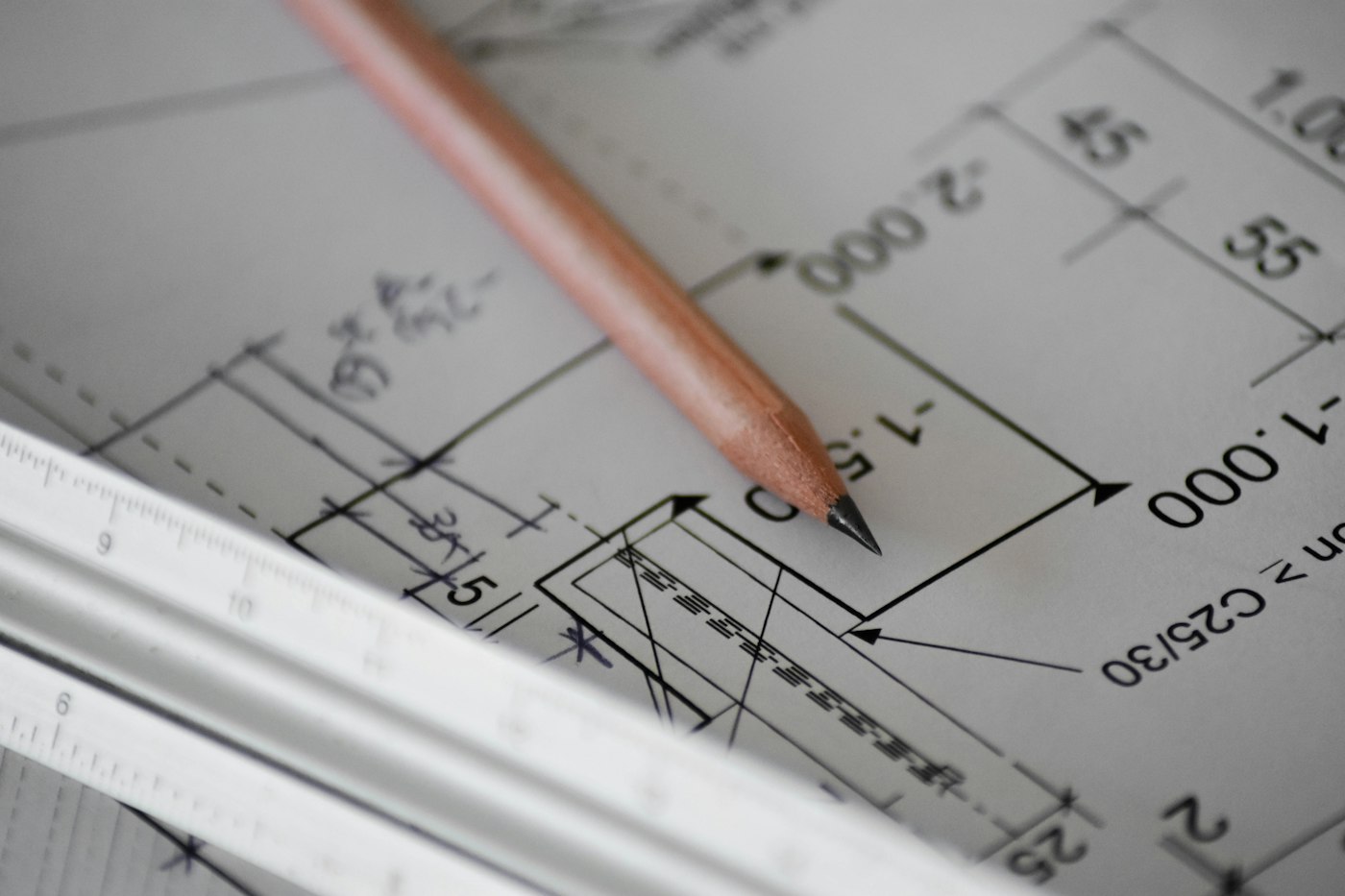 A written estimate and roof plans laid out on a table