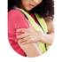 A worker in a high-visibility safety vest holds their upper arm in discomfort, indicating a shoulder or arm injury.