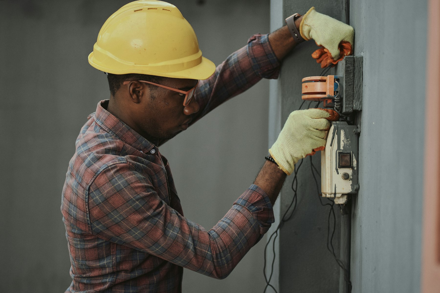 Licensed electrician on site preparing an EV charger circuit
