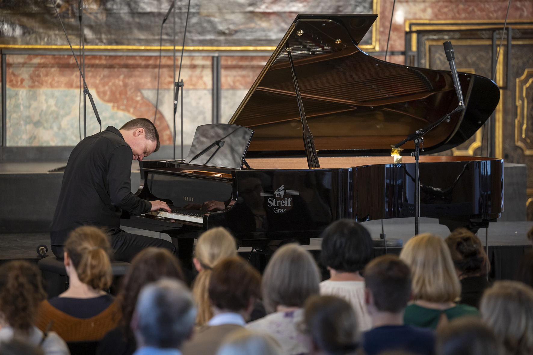Close-up of Ola Gjeilo during his piano recital in the Minoritensaal, Voices of Spirit 2024, Graz