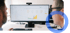 Zwei Männer betrachten einen Computermonitor mit Diagrammen und Grafiken auf dem Bildschirm.