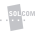 Logo: Graues Rechteck mit "SOLCOM" auf grünem Hintergrund, durchbrochen von gepunkteter Linie.