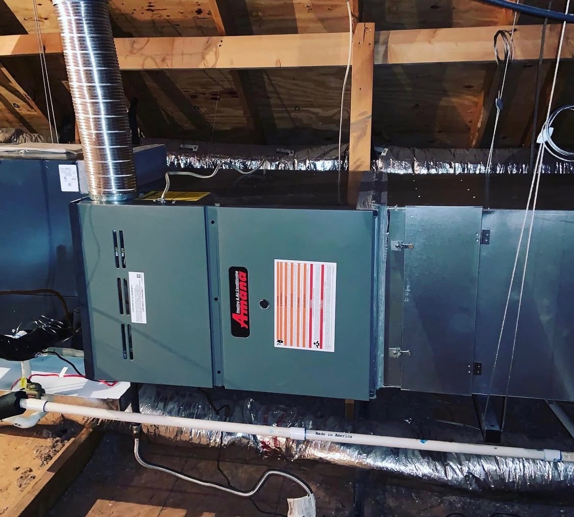 Amana gas furnace and air handler installed in a residential attic with insulated duct work