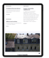 Webseite mit einem Bild eines traditionellen Hauses und einem weißen, minimalistischen Layout.