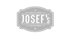 Grüner Hintergrund mit grauem Logo, das "JOSEF'S" in einer geschwungenen, gerahmten Form zeigt.