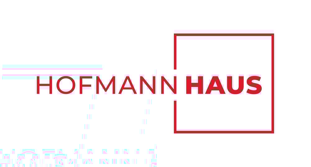 Roter Text "HOFMANN HAUS" mit "HAUS" in einem roten Rechteck auf weißem Hintergrund.