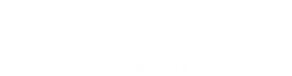 Weißes Logo mit stilisiertem Haus und Text "THE SUITES" auf schwarzem Hintergrund.