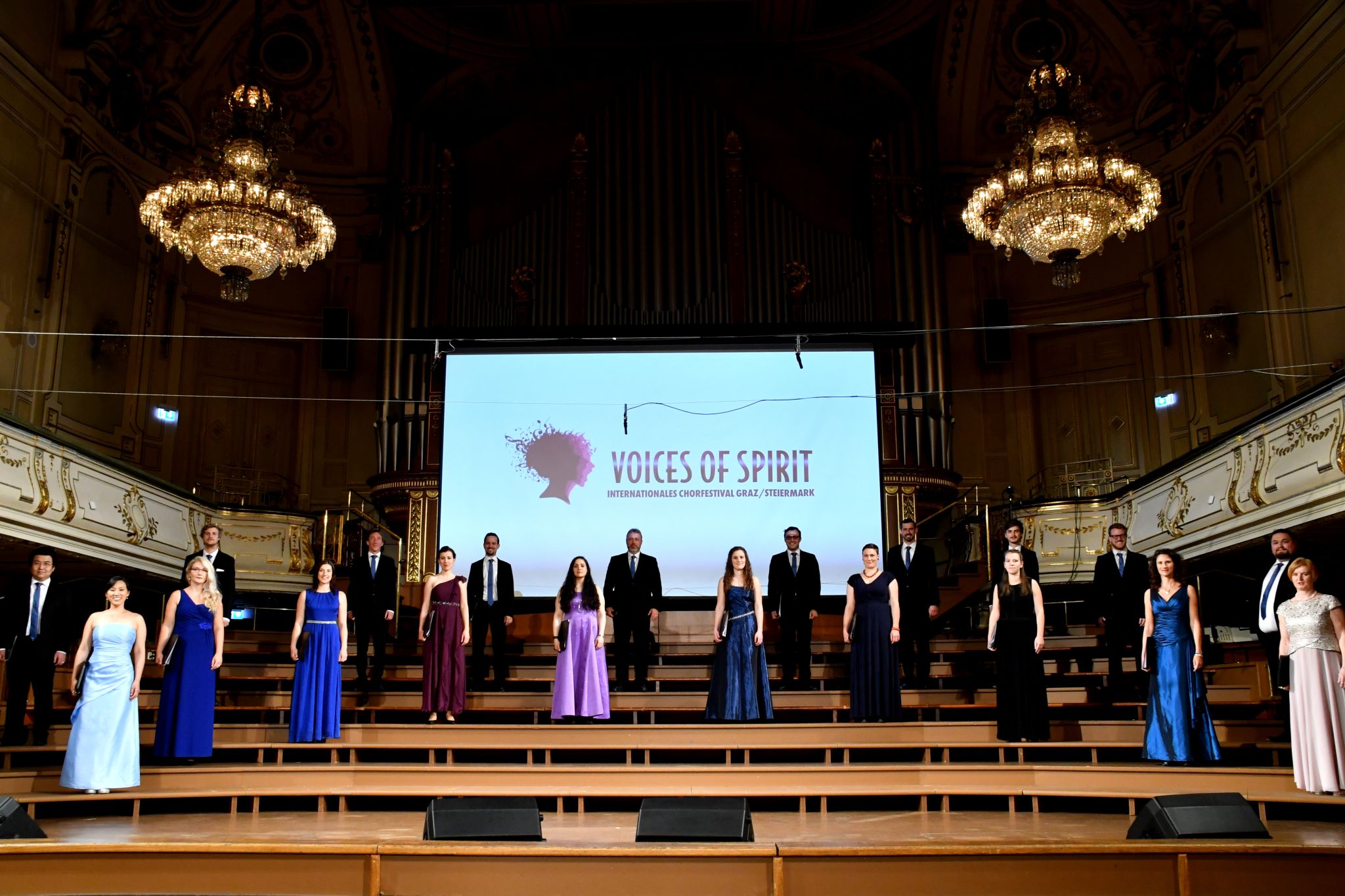 Conductor and choir during a Hello World concert, Voices of Spirit 2021, Graz