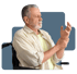 Older man in wheelchair clutching his wrist, illustrating Parkinson’s symptoms.
