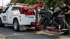 Towing Corona motorcycle towing service securing a sport bike onto a tow truck for safe transport.