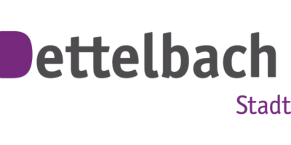 Detttelbach Stadt-Logo auf dunkelgrünem Hintergrund.