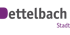 Dettelbach Stadt Logo mit lila und grauer Schrift auf dunklem Hintergrund.