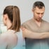 Professional examining a patient's arm and shoulder.