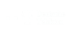 Logo der Deutschen Telekom mit drei weißen Quadraten, einem stilisierten "T" und dem Text "Deutsche Telekom".