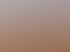 Three Arabian oryx with long straight horns standing on red sand dunes under a cloudy blue sky, Dubai desert